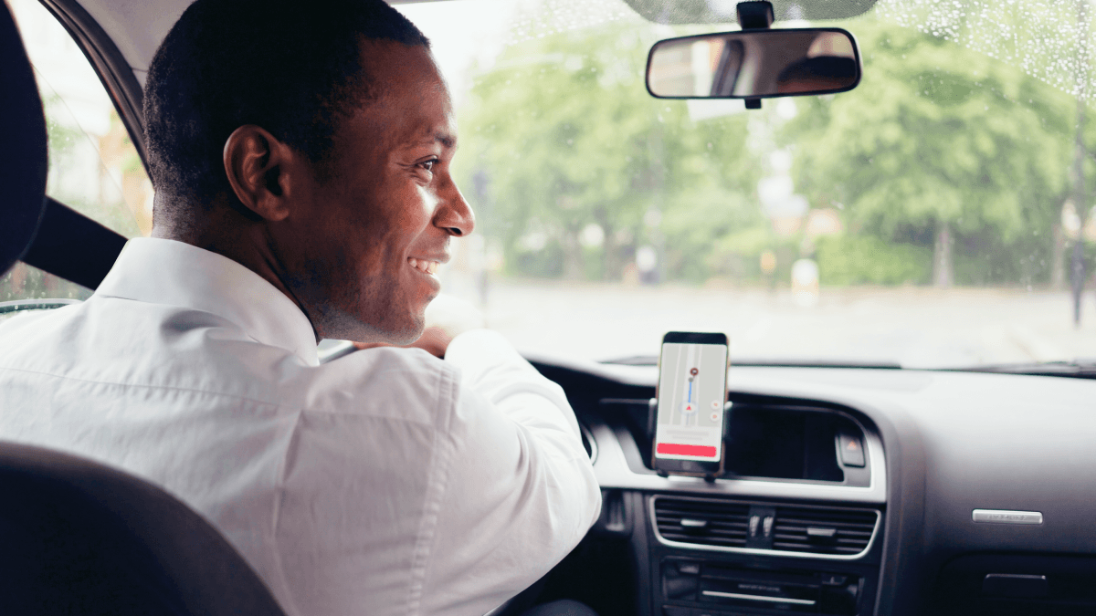 03_Medical rides_ Module 02_Exclusive allocation- Driver looking to the the side inside taxi_1200x675.png