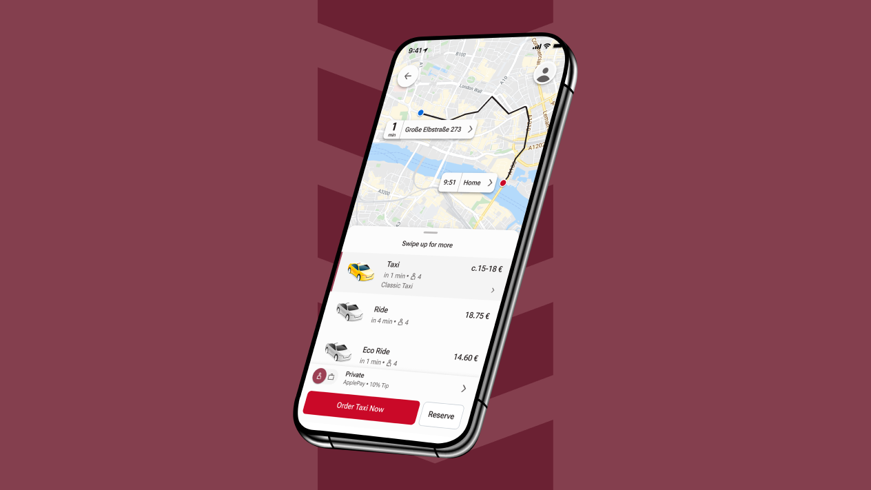 Telefon komórkowy z aplikacją FREENOW pokazującą taksówki i mapę.