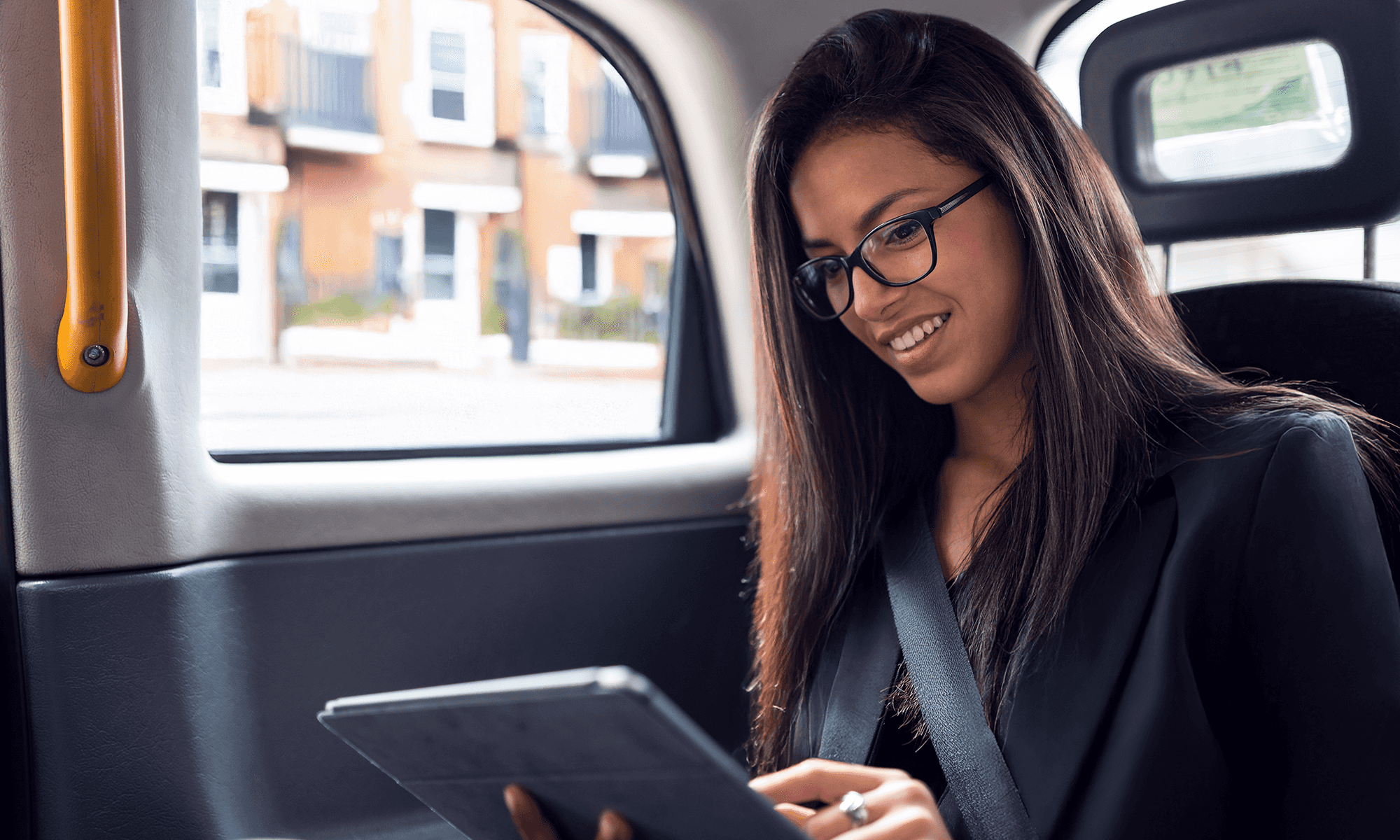 Business Traveller enjoying Freenow business taxi while he is going to his work meeting with the client