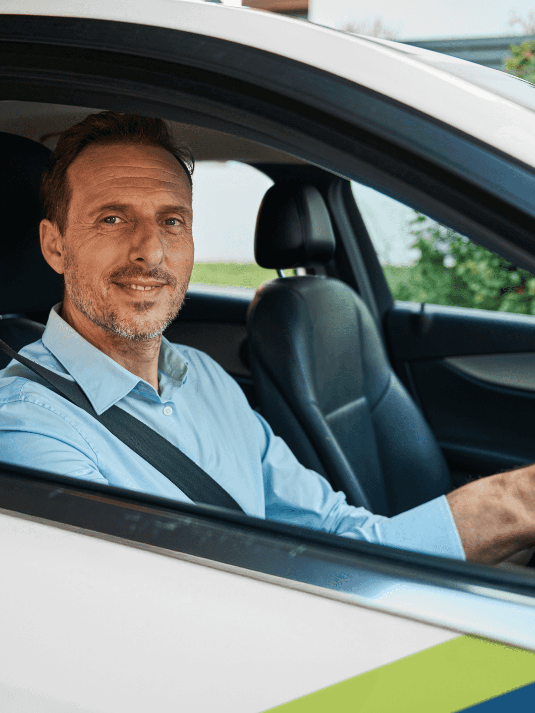 Taxi driver standing next to his car