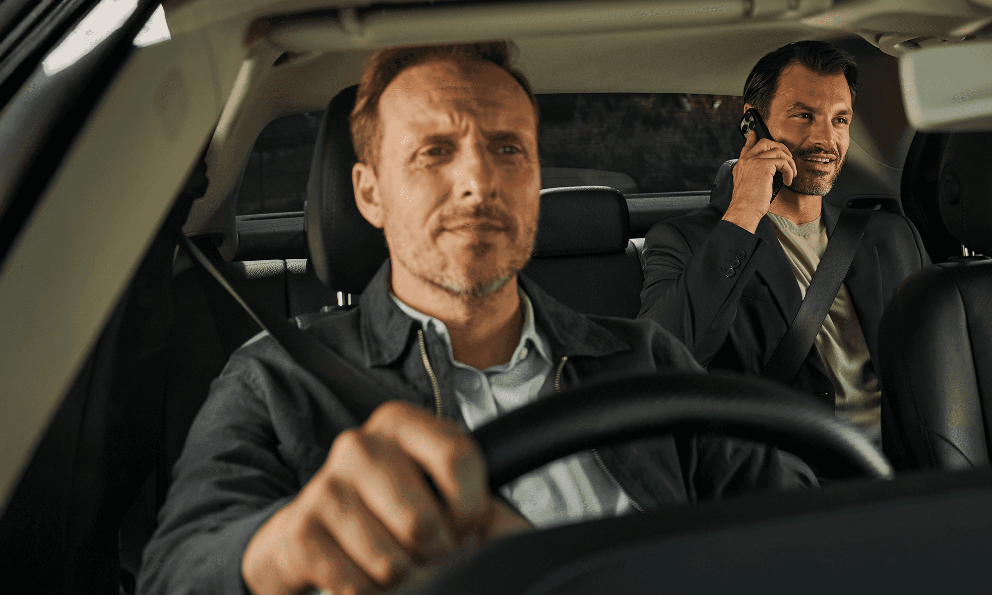 Business Traveller enjoying Freenow business taxi while he is going to his work meeting with the client