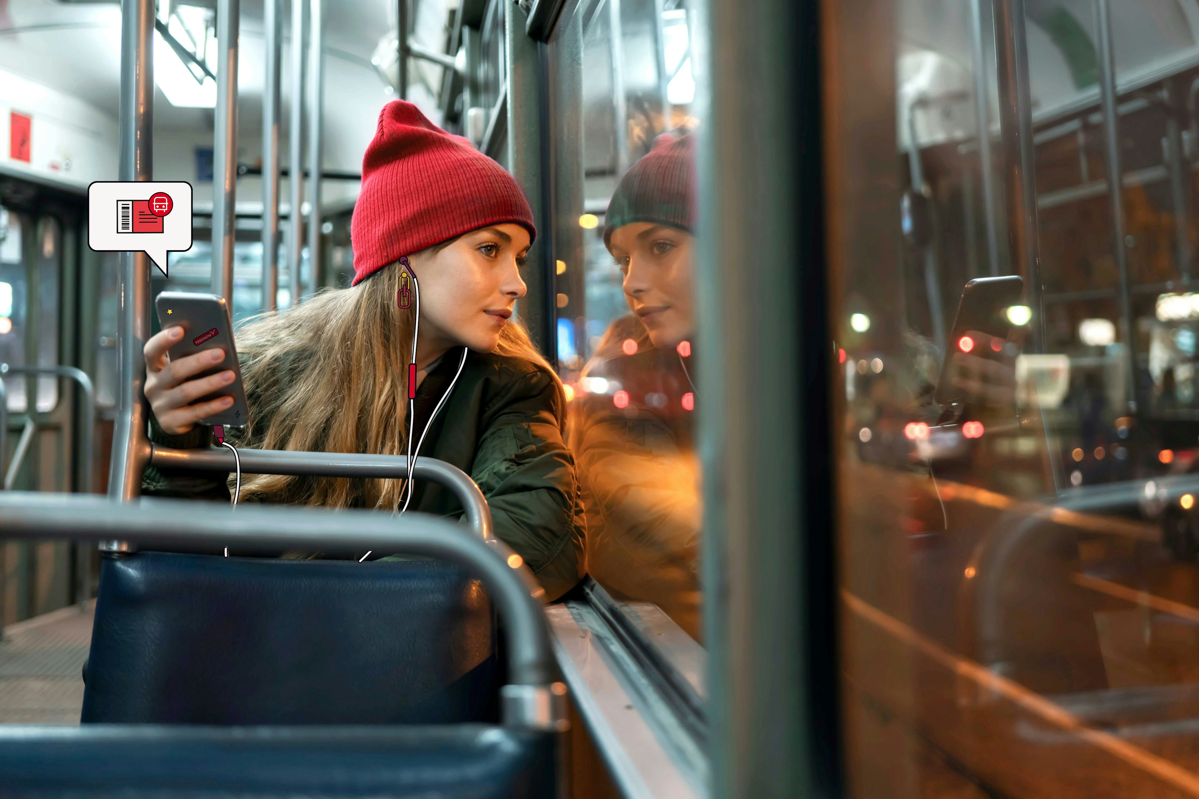Une employée assise dans un bus et regardant par la fenêtre. Elle peut acheter son billet de transport public avec le budget de mobilité FREENOW.