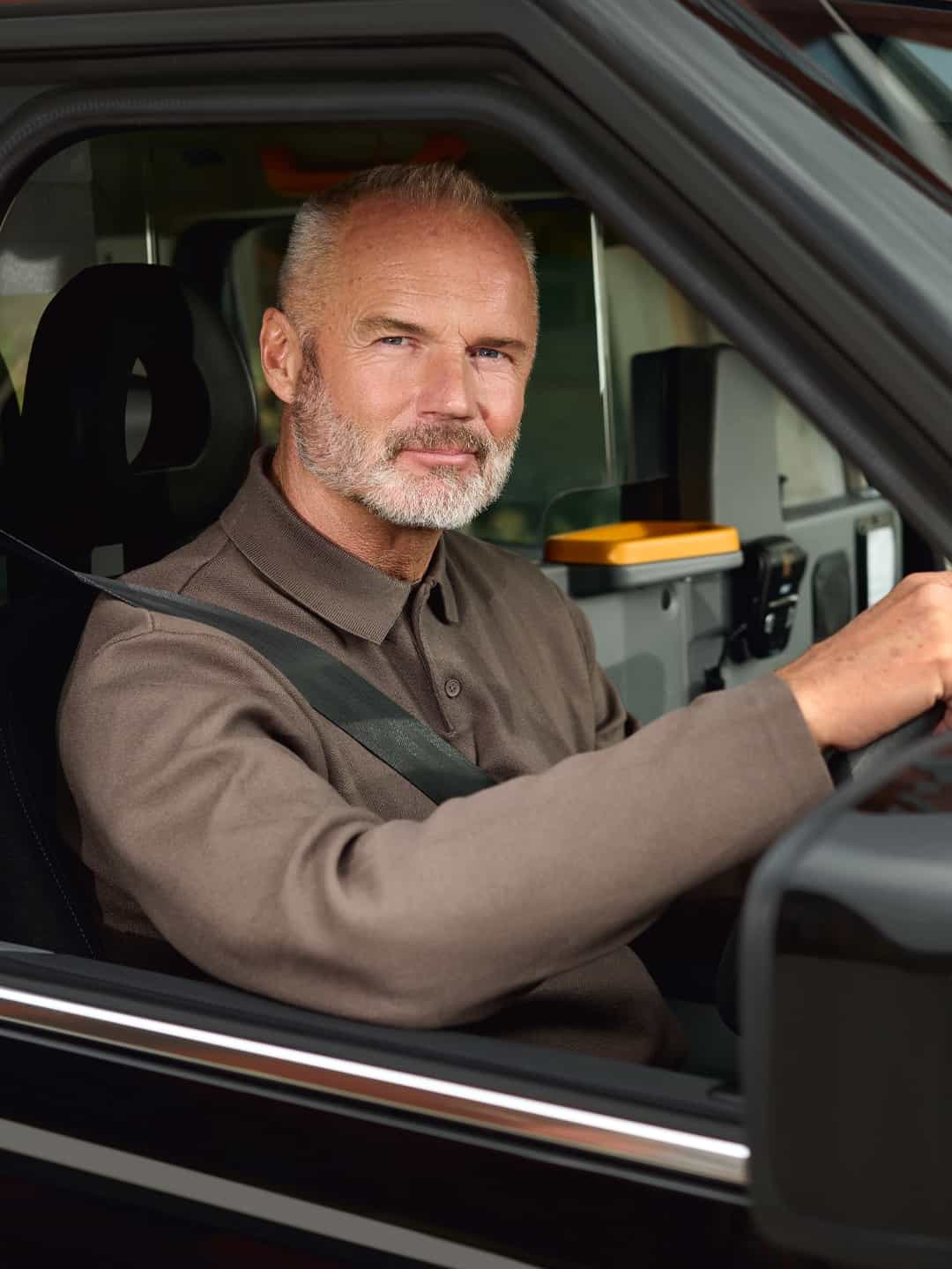 black cab driver driving