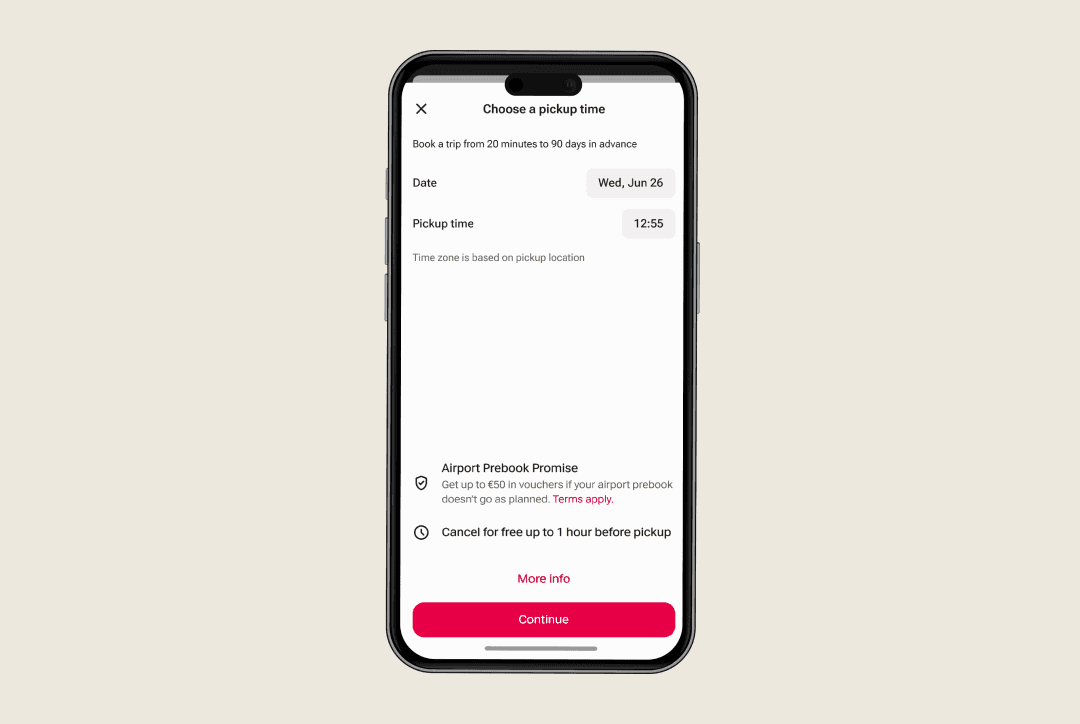 driver using FREENOW app in taxi